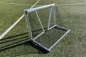 Preview: Klappbares Profi-Mini-Fußballtor mit Rundrahmen aus Aluminium, Abbildung geklappt auf Rasen liegend