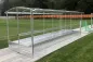 Preview: Eine doppelte Aluminium Spielerkabine mit Dach und Plexiglasscheiben auf Sportplatz