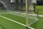 Preview: Holz-Fußballtor, Typ 2, in Hülsen stehend auf Fußballplatz, Detail Bodenrahmen aus Aluminium Preview: Holz-Fußballtor, Typ 2, in Hülsen stehend auf Fußballplatz, Detail Bodenrahmen aus Aluminium